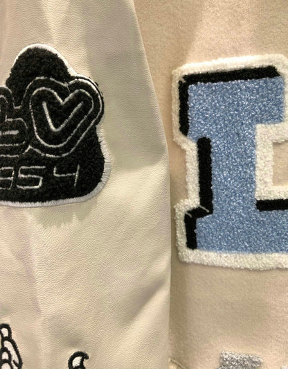 Jaqueta Varsity Couro e Lã Aplicações Coloridas