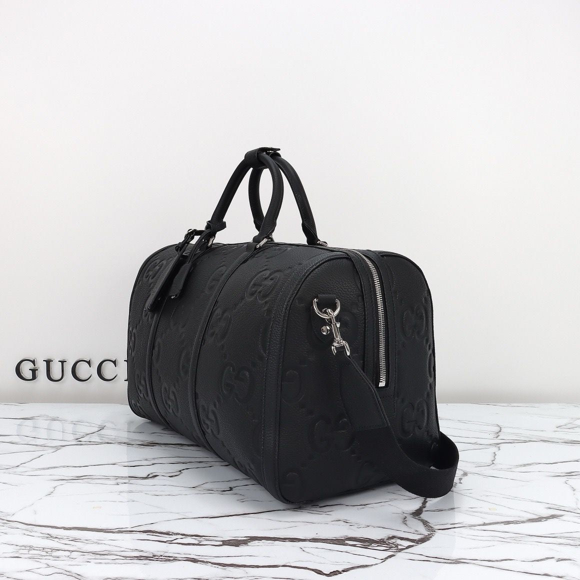 Bolsa Duffle Couro Padrão Letras Entrelaçadas Marrom Grande