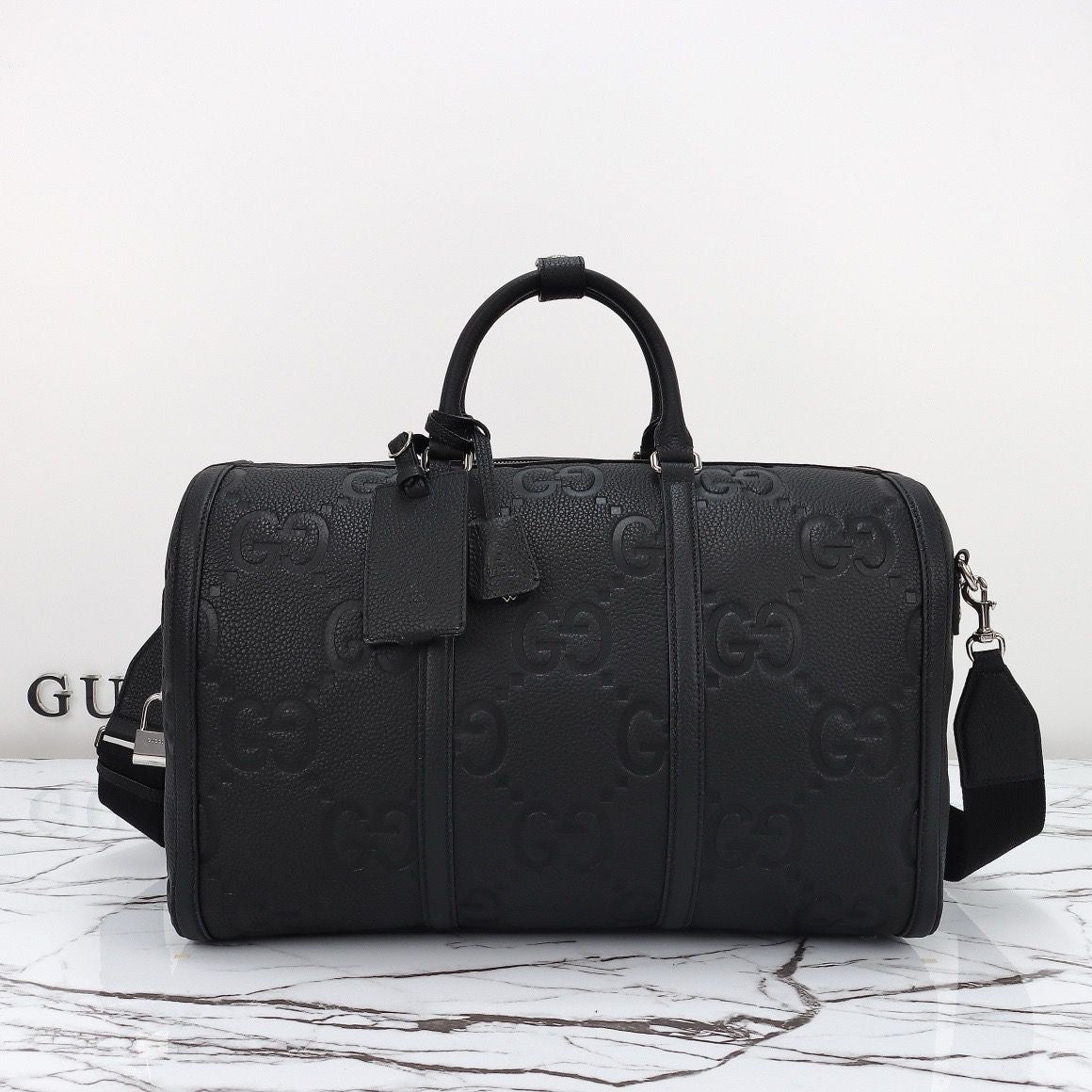 Bolsa Duffle Couro Padrão Letras Entrelaçadas Marrom Grande